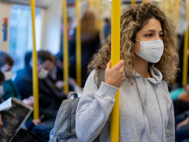 Woman wearing mask on train.jpeg